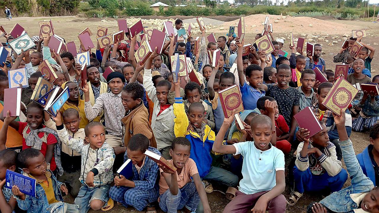 Orphans receiving Qurans